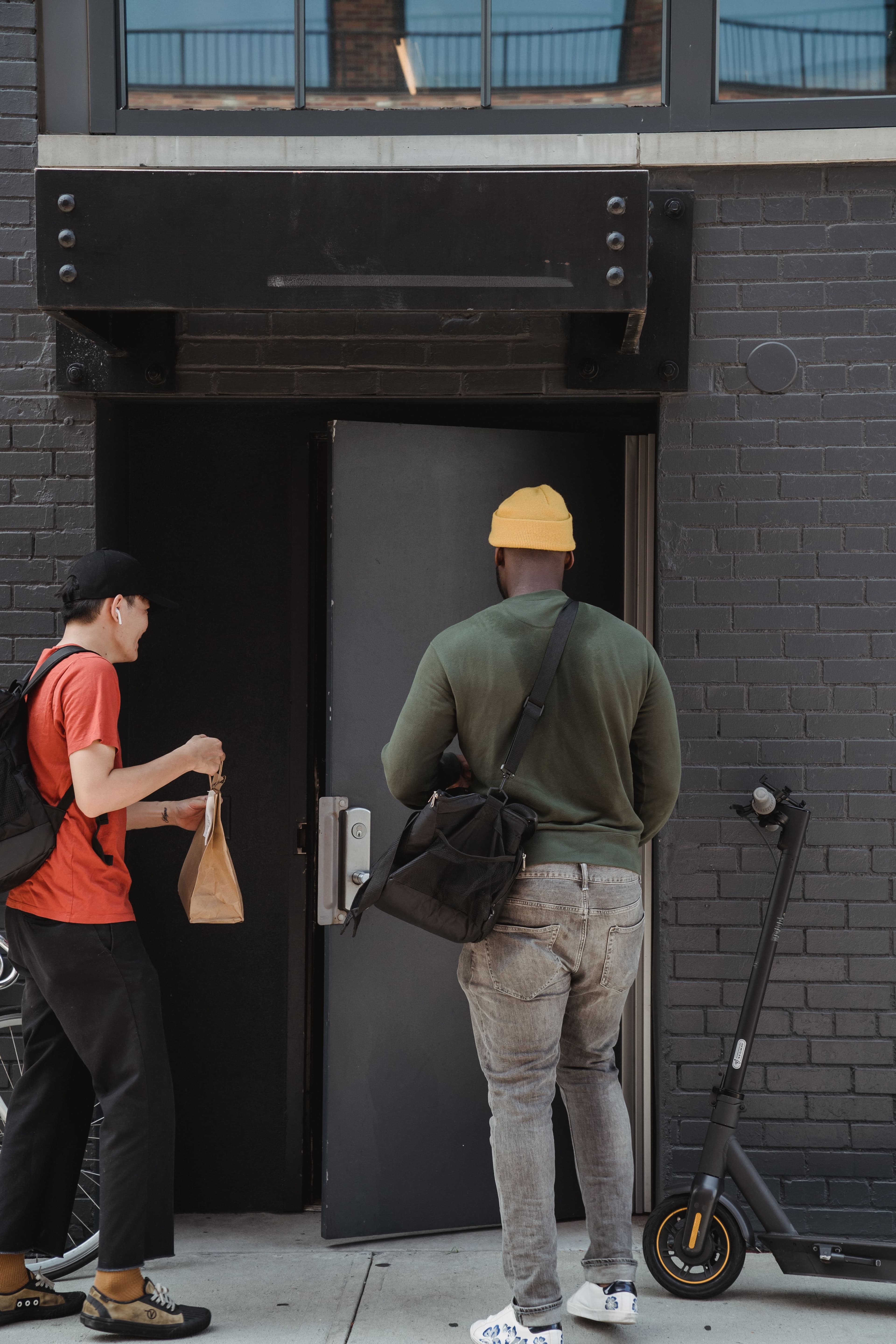 Inspection visit — student and agent at a door